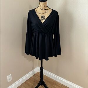 Black peplum blouse with bell sleeves
